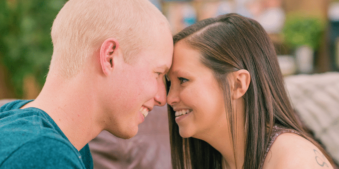 Happy couple smiling at each other.